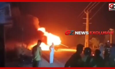 भिवानी के मिलकपुर गांव के पास जलती निजी बस का दृश्य।