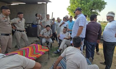 सोलर लाइन विवाद को लेकर मौके पर जुटे ग्रामीण और अधिकारी।