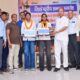 नारनौल के अंबेडकर भवन में राज्य टॉपर छात्राओं को सम्मानित करते अतिथि।