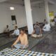 तोबड़ा गांव में आयोजित योग शिविर में योगाभ्यास करते ग्रामीण